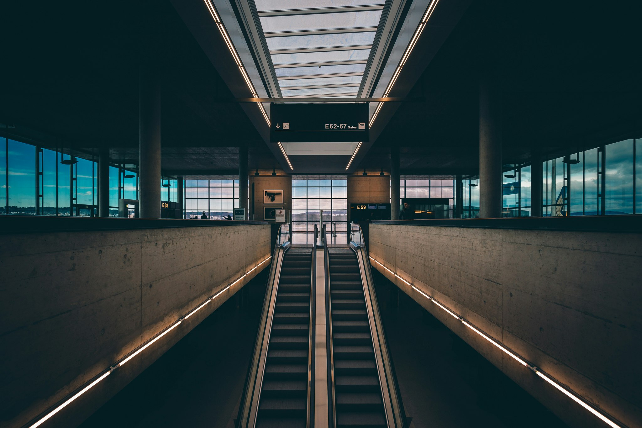 black and brown escalator inside building